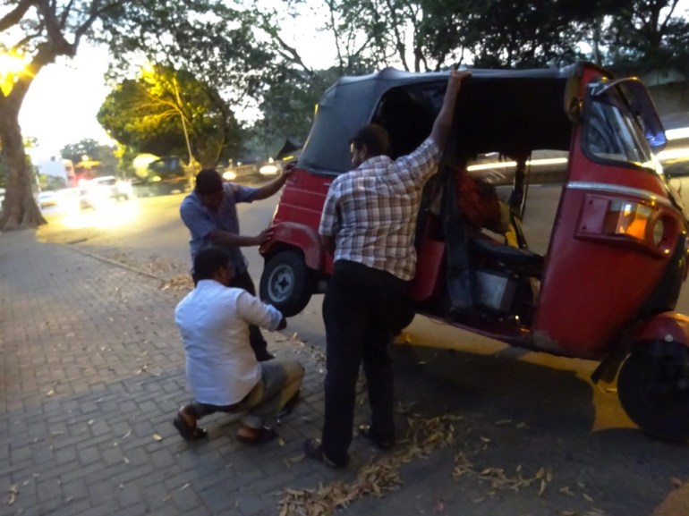 replacing wheel on a tuk tuk