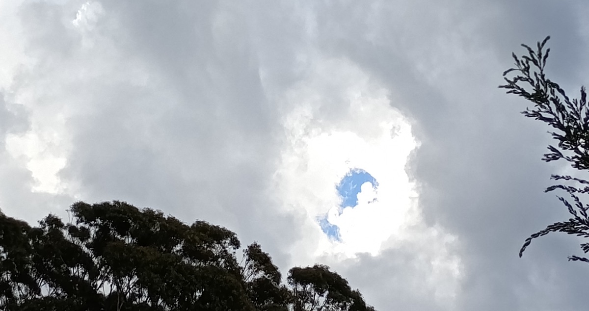 sunlight through grey clouds